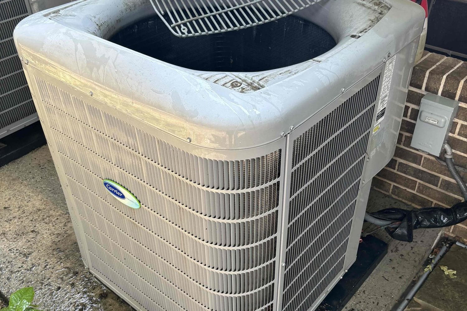 Foaming coil cleaner applied inside a condenser unit during maintenance
